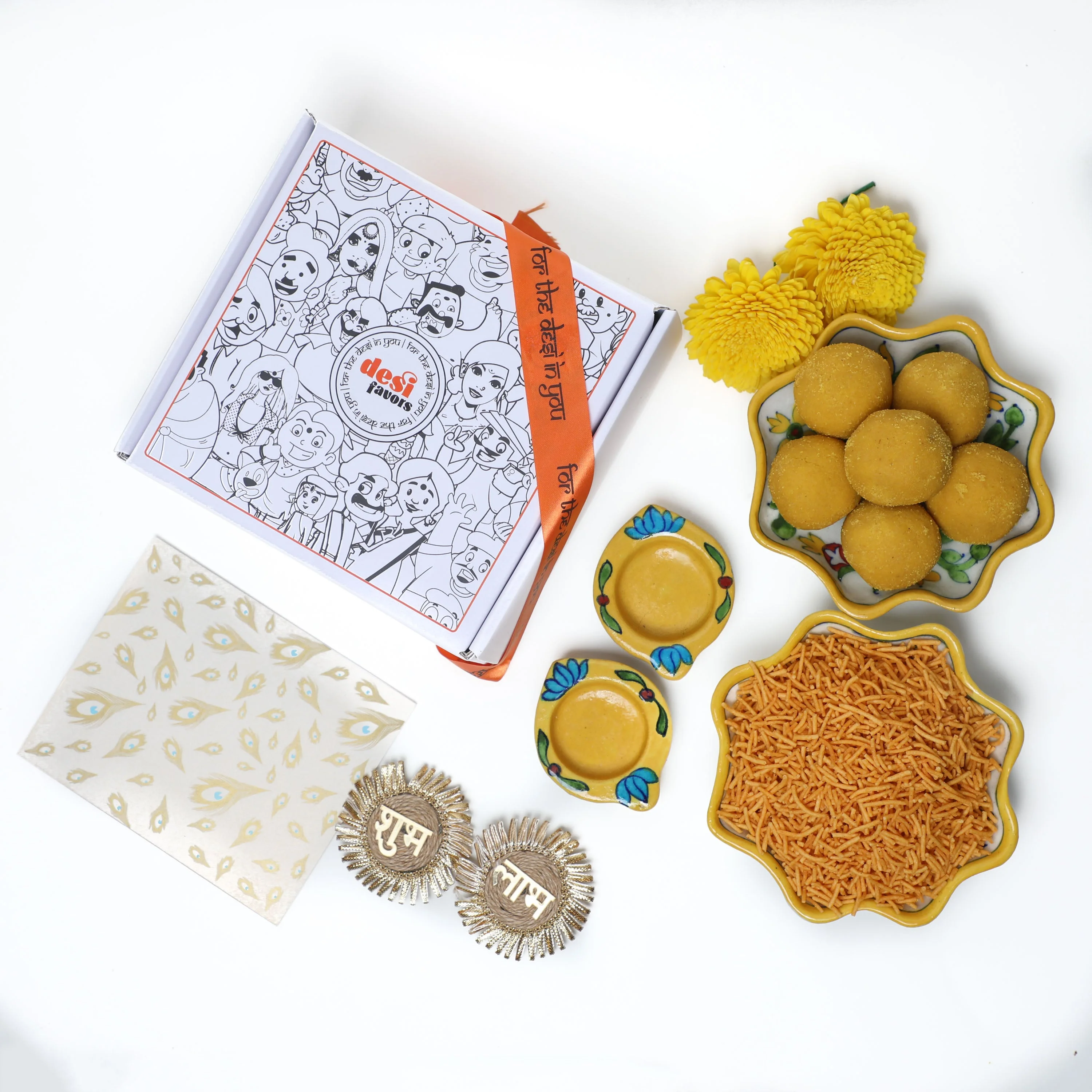 2 Blue Lotus painted Tealight holders + 250gm Besan Laddu + 250gm Namkeen + &nbsp;Shubh Labh Stick ups + Diwali Greeting