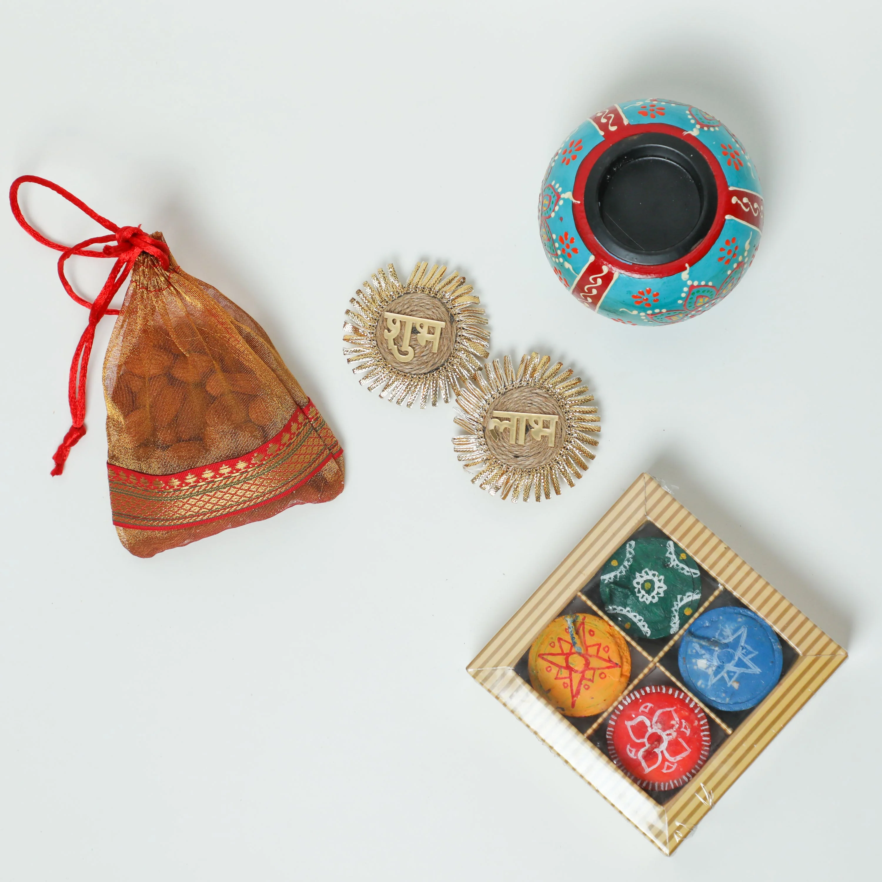 Tealight holder + Small pouch of dry fruit +&nbsp;Shubh Labh + Diyas