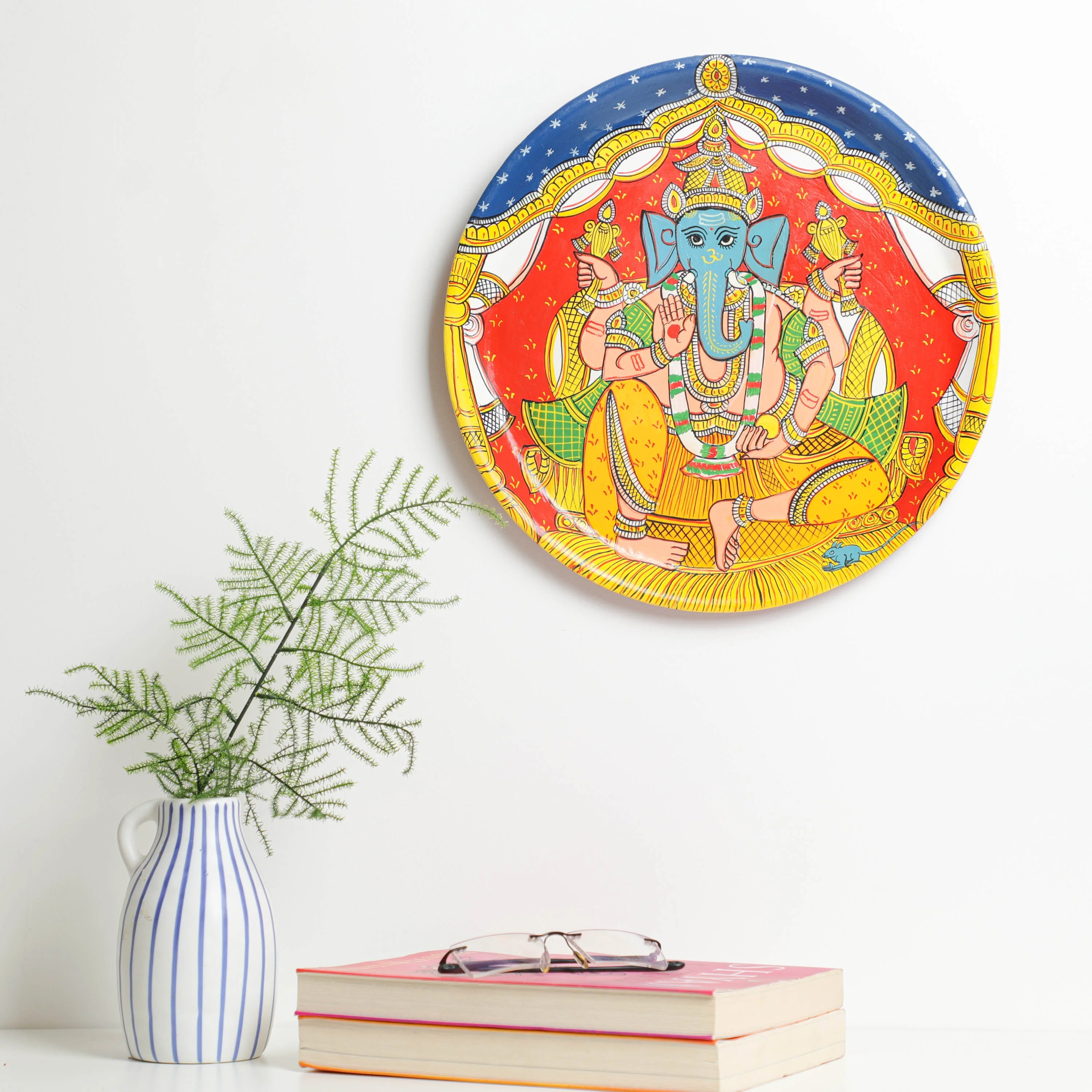 Material: This vibrant cheriyal wall plate &nbsp;is hand-painted using natural colours on a canvas, stretched over a plate&nbsp;